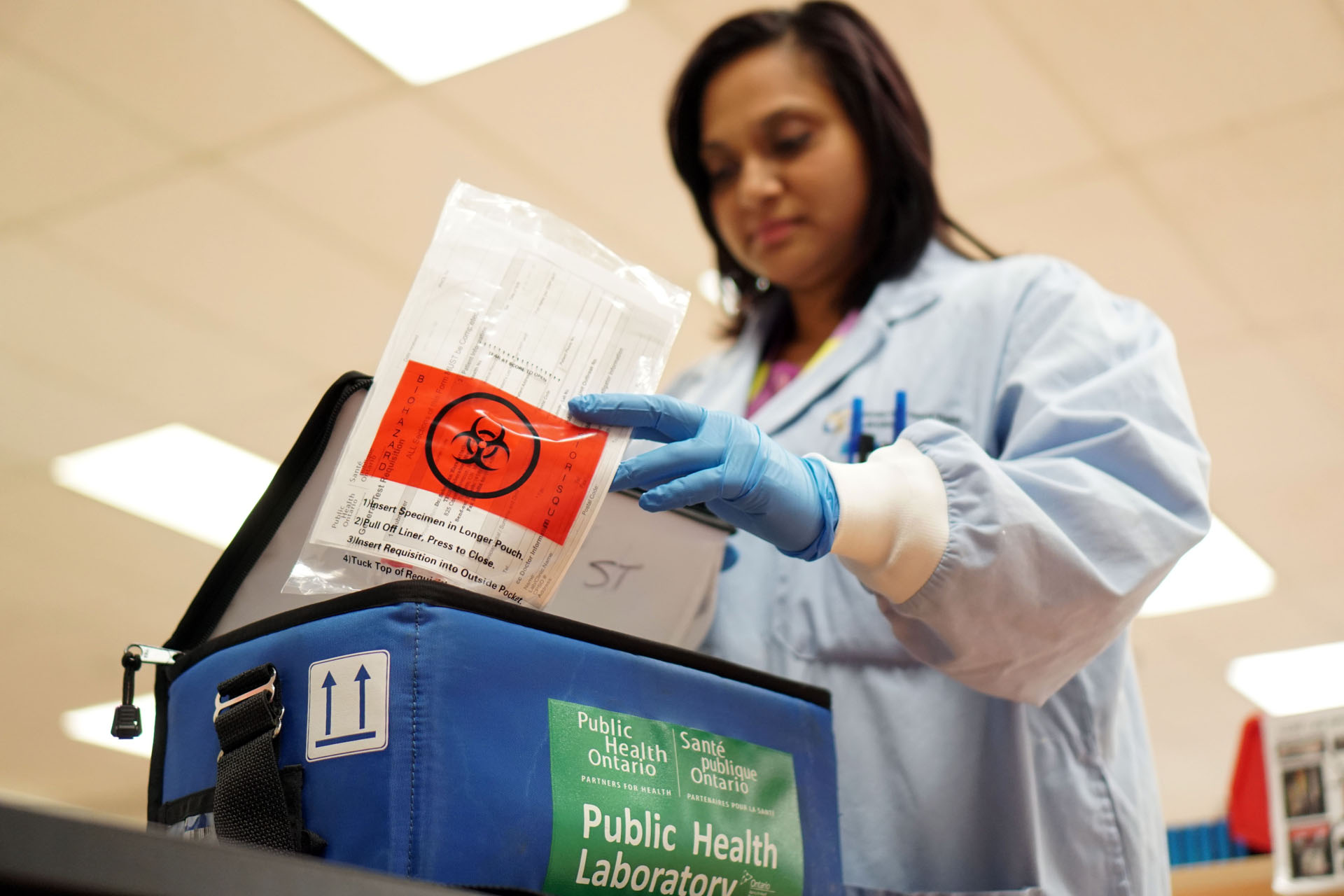 Healthcare worker holding PCR test