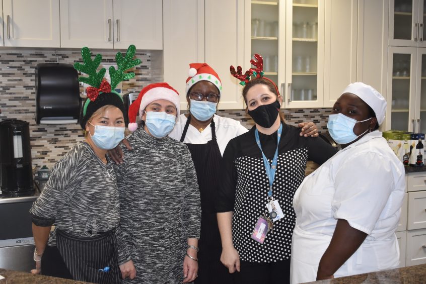 Staff at Les Centres d’Accueil Héritage wearing Santa hats and reindeer ears