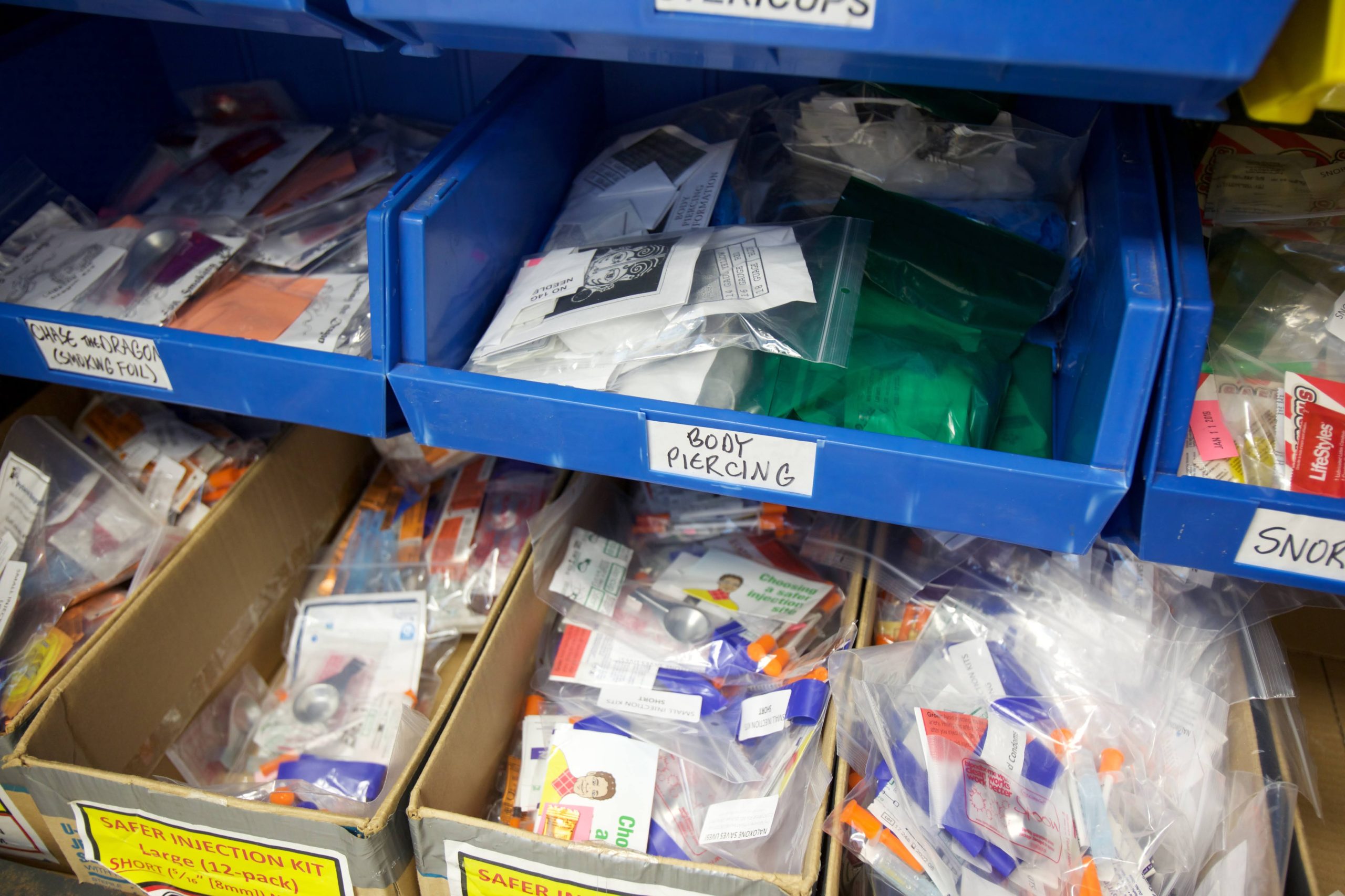 Containers of safe supplies, such as safer injection kits